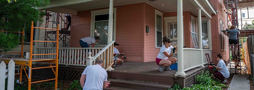 Group of people working on a volunteer housing project