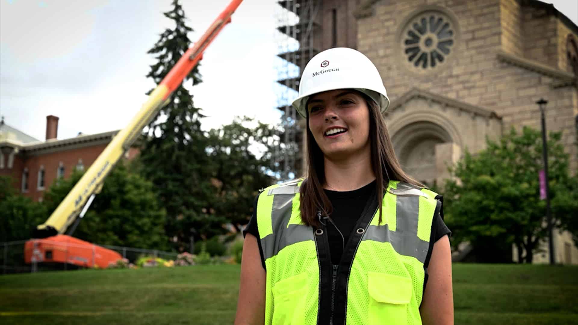 Image of McGough intern Lindsey Hays, wearing hard hat and yellow vest