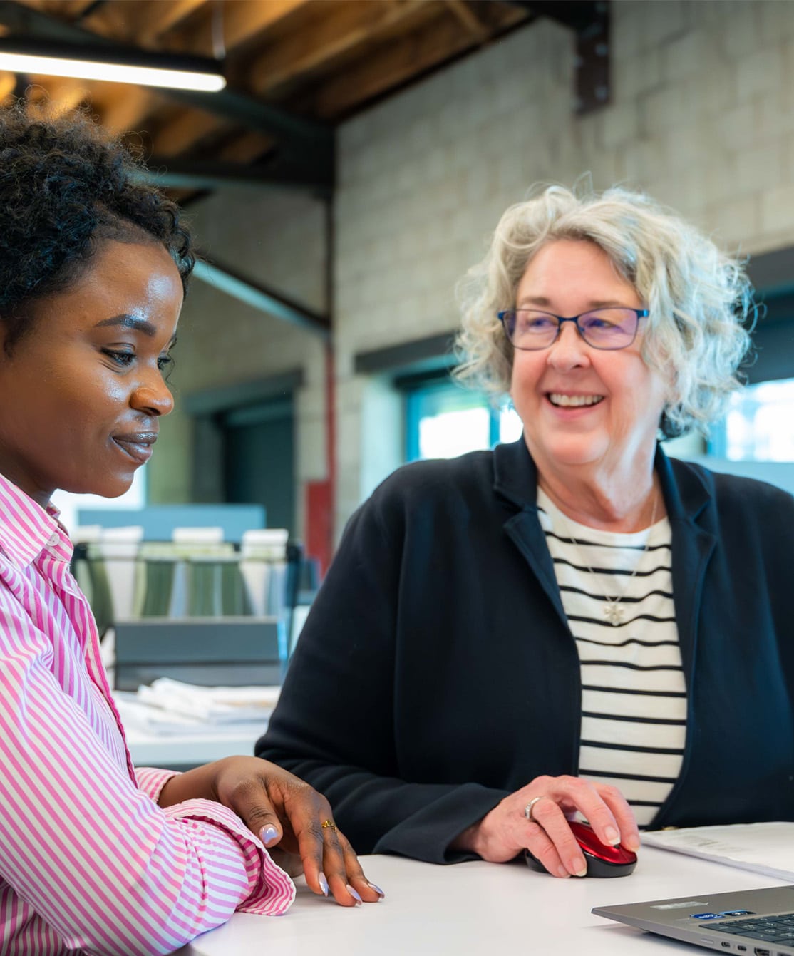 Image of McGough Estimator Val Hanson and a co-worker