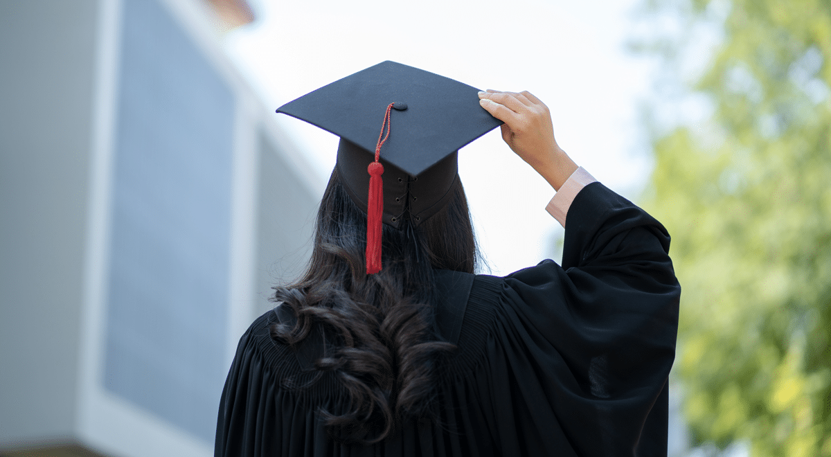 Graduate in cap and gown