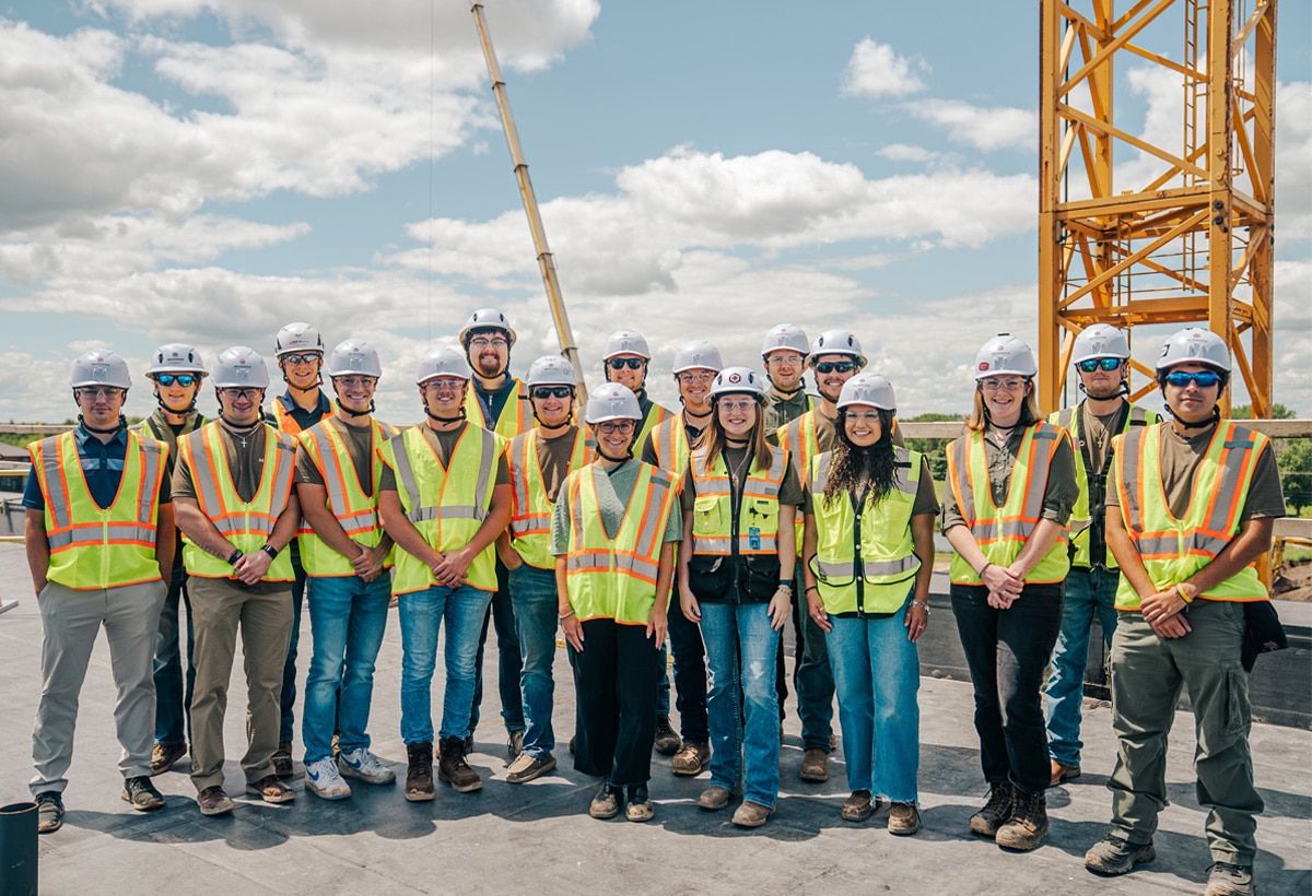 Diverse group of McGough interns in protective gear on a work site